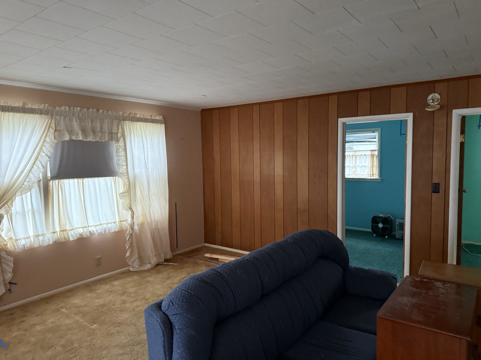 Older Marblehead cottage living and kitchen area before remodel